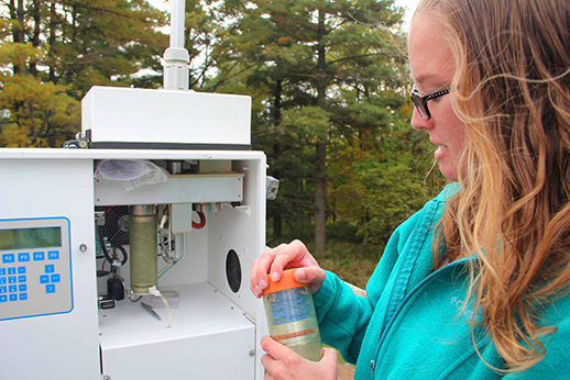 Allison Streeter, environmental analyst, caps an exposed
filter magazine at one of 29 Ambient Air sites in Iowa.