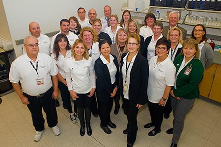 Ankeny staff who organized an open house and Coralville colleagues gather during the event.
